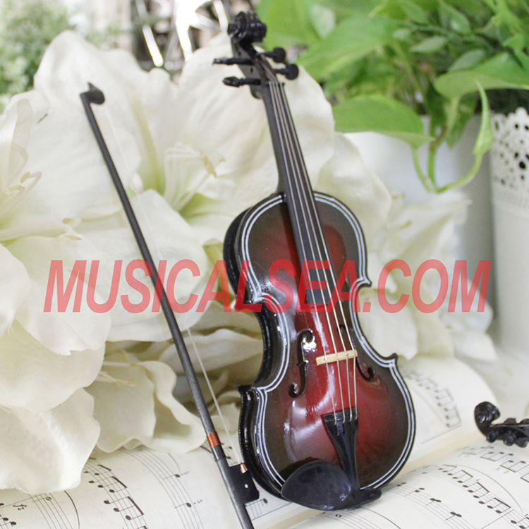 miniature wooden musical instrument